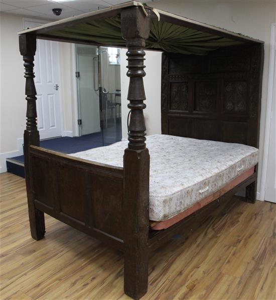 A 17th century carved oak tester bed, W.4ft 6in. H.6ft 1in. L.7ft 2in.